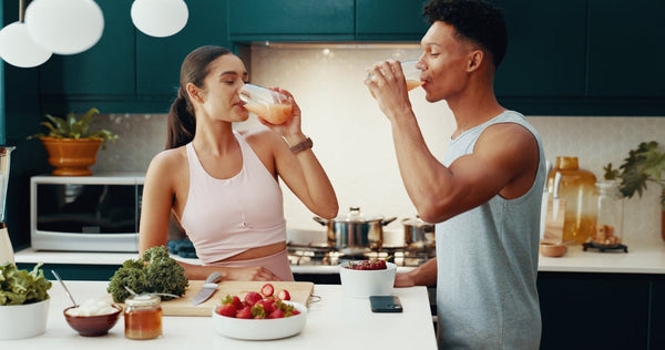 Image of a female and male eating a healthy morning breakfast.